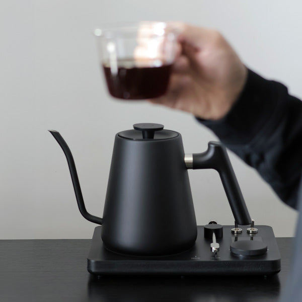 Lafeeca black electric kettle with a gooseneck spout and a DJ turntable base, designed for pour-over coffee brewing. #color_black