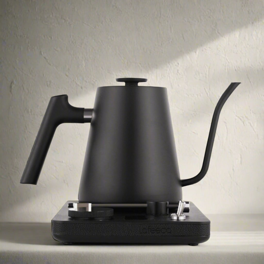Lafeeca black electric kettle with a gooseneck spout and a DJ turntable base, designed for pour-over coffee brewing. #color_black
