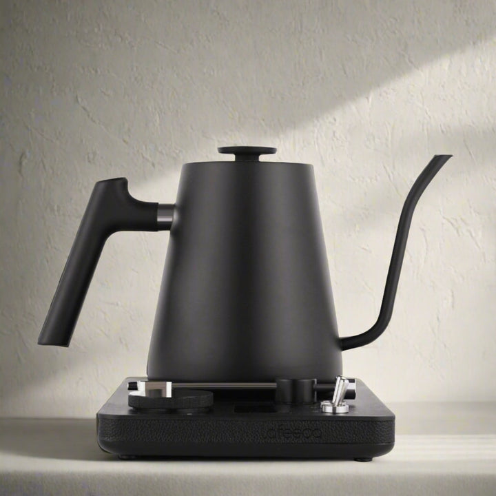 Lafeeca black electric kettle with a gooseneck spout and a DJ turntable base, designed for pour-over coffee brewing. #color_black