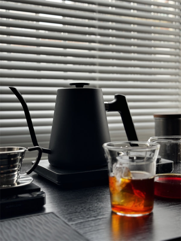 Lafeeca black electric kettle with a gooseneck spout and a DJ turntable base, designed for pour-over coffee brewing. #color_black