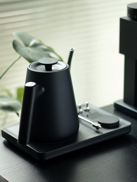 Lafeeca black electric kettle with a gooseneck spout and a DJ turntable base, designed for pour-over coffee brewing. #color_black