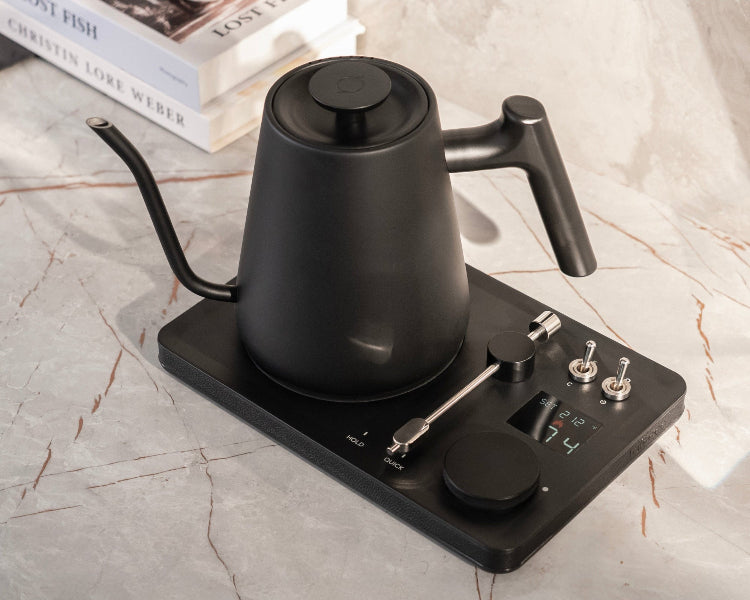 Lafeeca Black gooseneck DJ kettle on a marble surface with a white cloth background